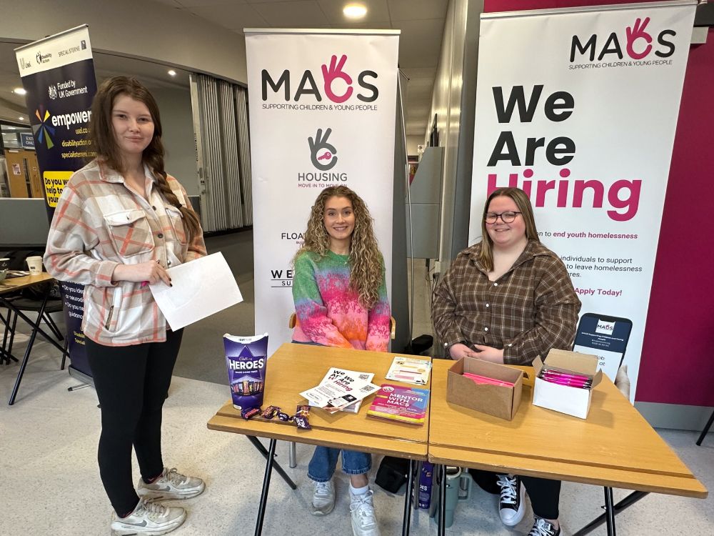 Student Emily Walsh with MACS representatives, Anna Geddis and Sophie Marshall.